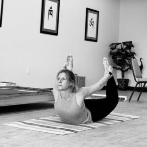 Demonstrating Bow Pose in the Institute for Spirituality and Health at the Yoga Institute.